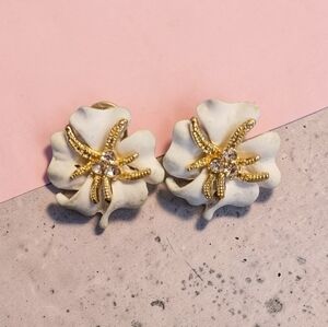 Floral-shaped, white enamel earrings featuring a gold-toned starfish &rhinestone
